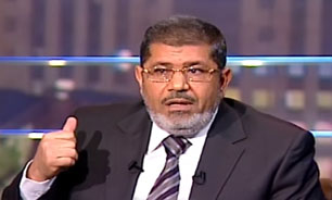 مرسی: وظيفه ملي ما گرفتن انتقام خون شهدا است