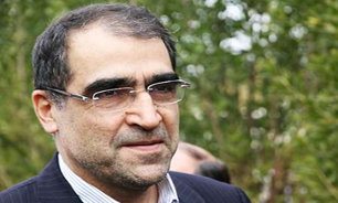 حضور وزیر بهداشت در مزار شهدای گمنام شهر بانه و ادای احترام به شهدا