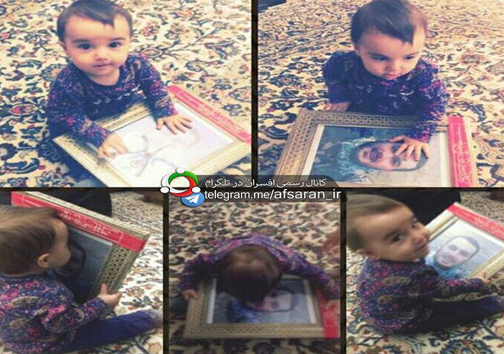 عکس/بوسه دخترک بر عکس پدر