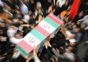 تشییع پیکر شهید گمنام زیر باران در همدان