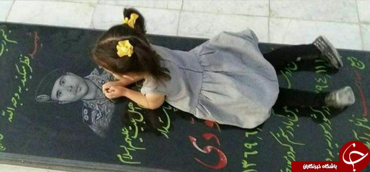 شهیدی که دختر سه ساله خود را در آغوش گرفت +تصاویر