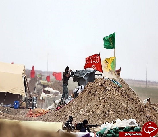 تصاویر آرایش نظامی حشد شعبی در &laquo;تلعفر&raquo; / واکنش جالب رزمنده عراقی به نماد داعش