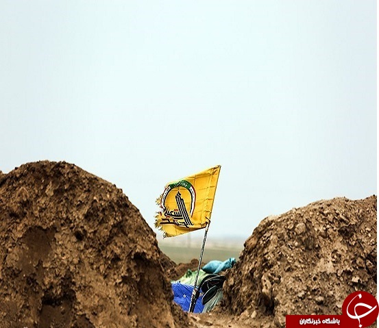 تصاویر آرایش نظامی حشد شعبی در &laquo;تلعفر&raquo; / واکنش جالب رزمنده عراقی به نماد داعش