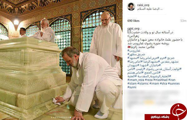 غبارروبی ضریح امام رضا (ع) توسط حجة الاسلام رئیسی +تصاویر