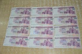 جاعل اسکناس و دلار در دام پلیس افتاد