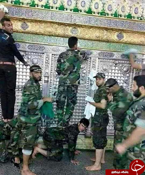 غبار روبی ضریح حضرت زینب (س) توسط مدافعان حرم + تصویر