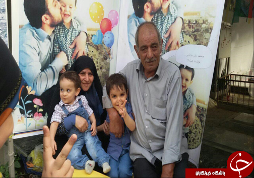 جشن تولد فرزند شهید مدافع حرم در جوار مزار پدر +تصاویر