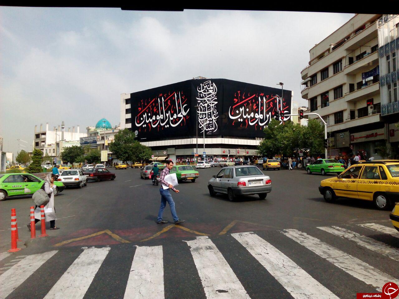 نصب بیلبورد علی امیرالمومنین (ع) در میدان انقلاب + تصاویر