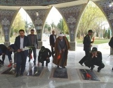 غبارروبی و گل افشانی قبور مطهر شهدا