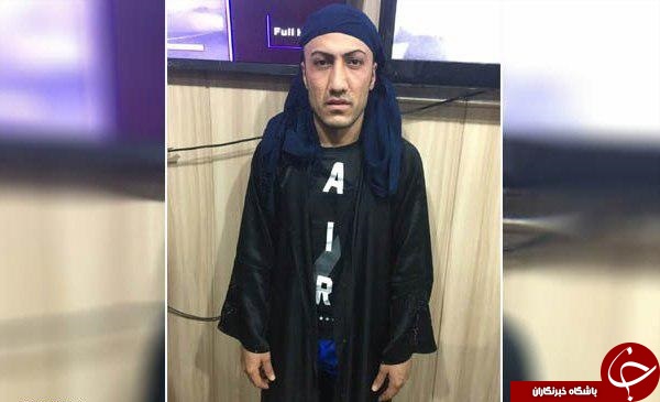 بازداشت یک تروریست داعشی ملبس به لباس زنانه + عکس