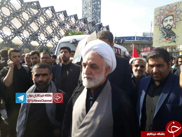 شکار تصاویر در مراسم تشییع شهید محیسن حججی