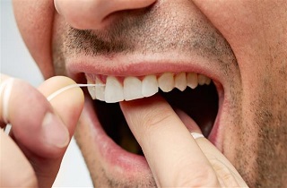 نخ دندان استفاده کنیم یا نه؟