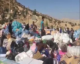 وضعیت نامناسب محل جمع آوری کمک های ارسال شده به زلزله زدگان +فیلم