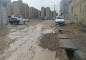 کمبود روکش آسفالت در خیابان‌های مسکن مهر بهبهان + فیلم