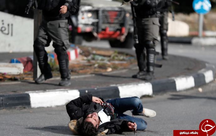 تصاویر روز: از درگیری نیروهای صهیونیست با فلسطینی&zwnj;ها تا قدم زدن کودکی در میان جمجمه&zwnj;های انسان&zwnj;ها