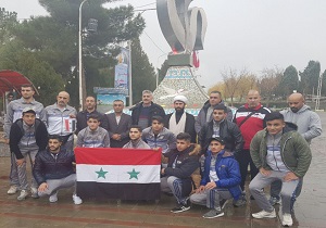 ادای احترام به مقام شامخ شهدا توسط اعضای تیم کشتی سوریه