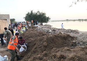 ساخت سیل بند در منطقه عین ۲ اهواز توسط گروه جهادی مسجدسلیمان