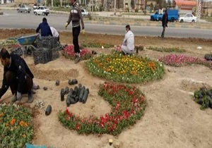اجرای فرش گل در میدان ورودی مجموعه تفریحی خورسیف بندر ماهشهر