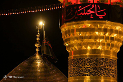 تعویض پرچم حرم مطهر حضرت شاهچراغ(ع)