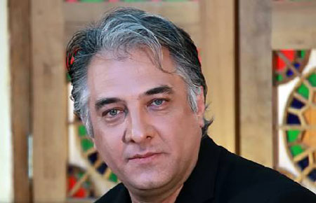 عکسی از کودکی ایرج نوذری در آغوش پدرش