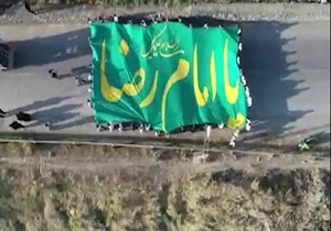 اهتزاز پرچم ۱۵۰ متری امام رضا (ع) در بام گرگان + فیلم