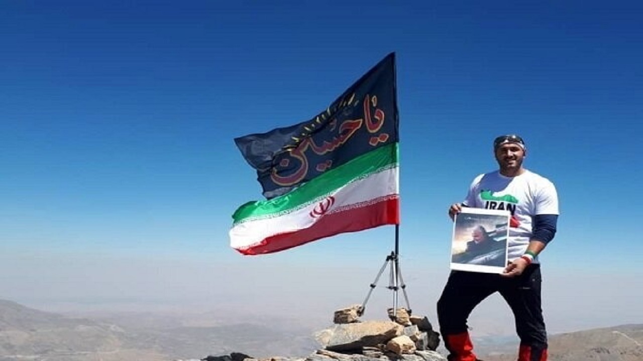 اهتزاز پرچم  یاحسین (ع) بر فراز قله شیخادار بلندترین قله کشور عراق