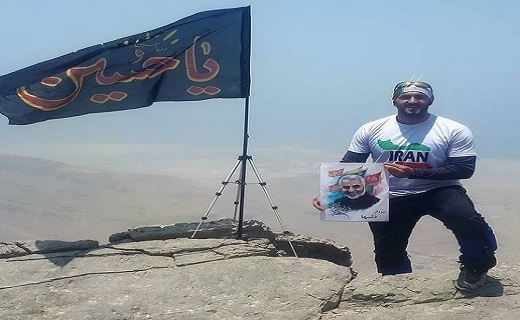 صعود جوان گیلانی با پرچم یا حسین (ع) به بلندترین قله امارات + تصاویر