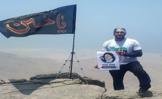 صعود جوان گیلانی با پرچم یا حسین (ع) به بلندترین قله امارات + تصاویر