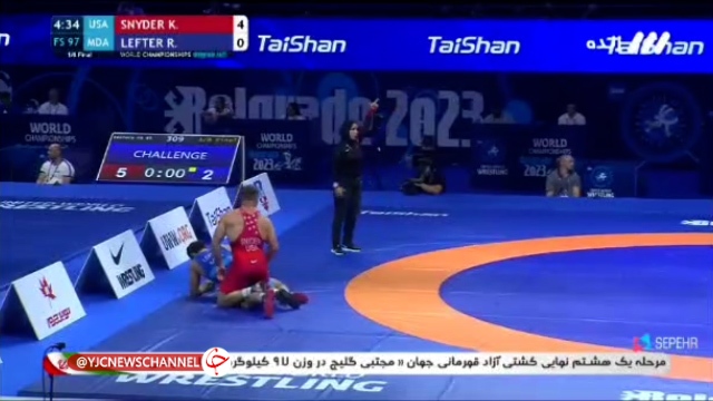 داوری یک زن محجبه در مسابقات جهانی کشتی + فیلم