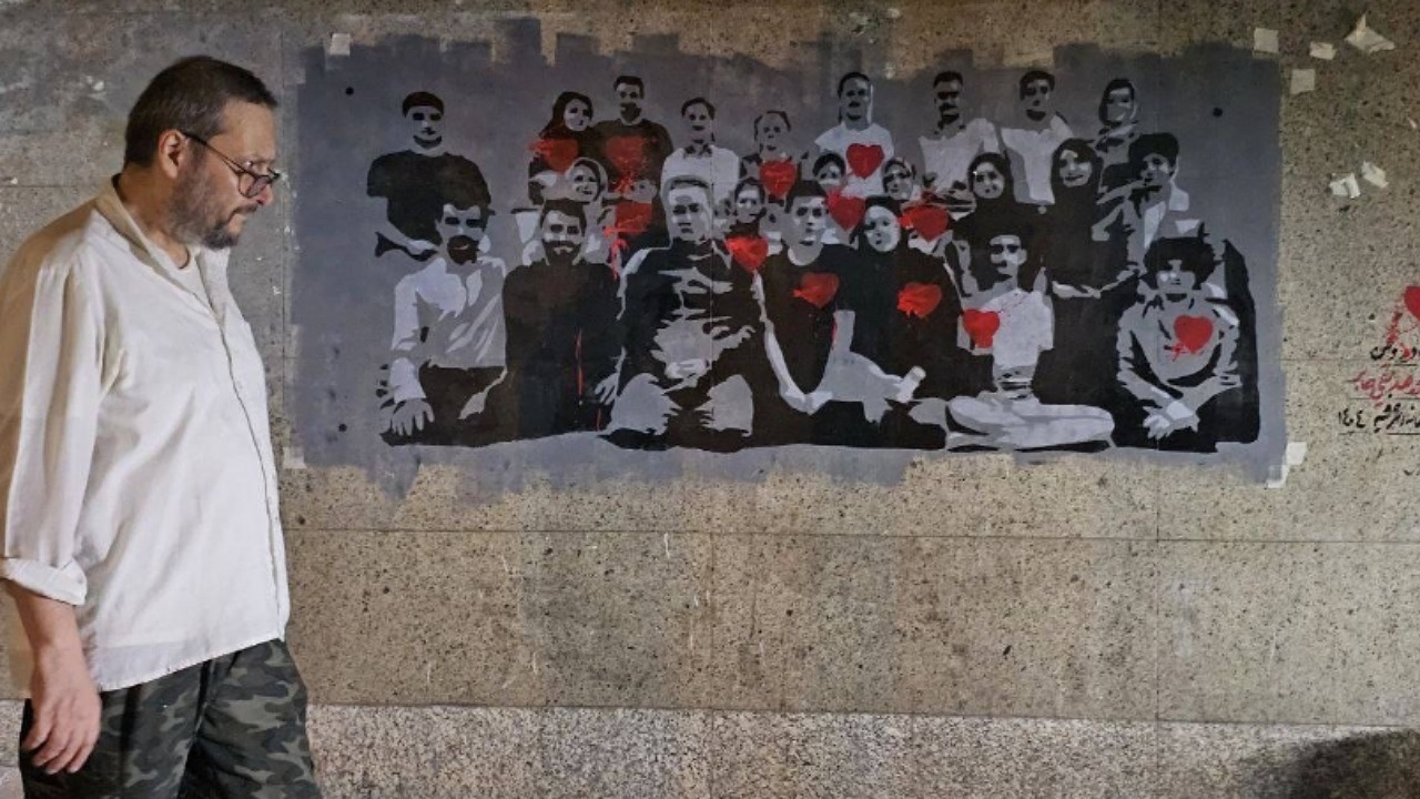 «نام جاوید وطن» به تصویر کشیده شد/ روایت نقاشی شهدا بر دیوار خیابان‌های تهران