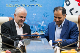 هادی اخلاقی فیض آثار مدیر عامل بانک ملت و سعید اوحدی رییس سازمان حج و زیارت