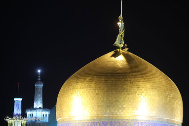 مراسم تعویض پرچم گنبد حرم امام رضا(ع)